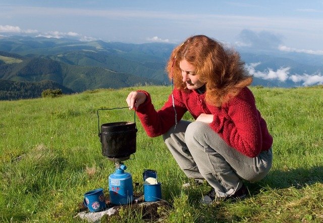 bigstock_Hiker_Girl_Making_A_Coffee_1401848